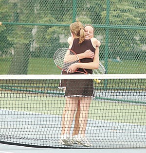 Sturgis’ No. 3 doubles team of Sami Setterblad and Meredith Donmyer hug after winning a regional championship on Thursday.