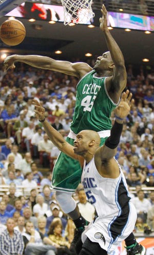 Kendrick Perkins applies pressure to Orlando's Vince Carter during Tuesday's game.