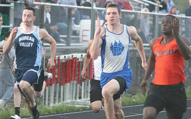 Kewanee’s Dontae Pryor holds off Blake Quiram of Princeton and Adam Sanden of Bureau Valley to win the 100-meter dash Friday night at the Erie Sectional.