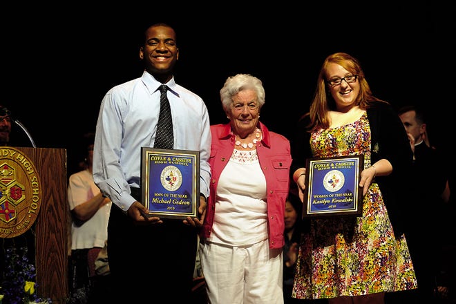 Louise Scanlon, center, poses with Michael Gedeon, Man of the Year, and Kaitlyn Kowalski Woman of the Year.