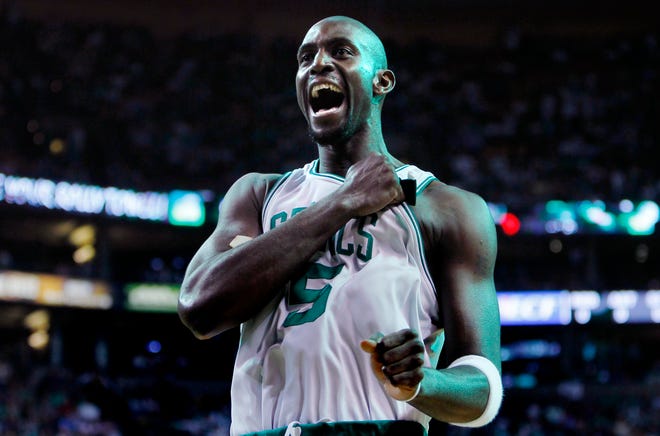 Kevin Garnett pounds his chest as he heads to the floor to face the Magic in Game 3 of the NBA Eastern Conference finals on Saturday night at the Garden.