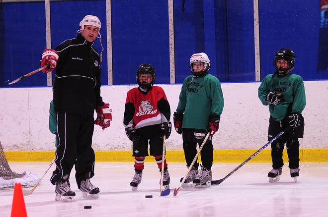 Travis Richards works with youth hockey players at the Edge Ice Arena Tuesday afternoon.
