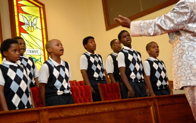 The Young Men of Integrity Boys Choir of Hodge Elementary Prep School is conducted by Alucia Walton, director. (Carl Elmore/Savannah Morning News)