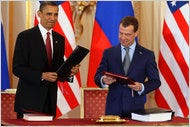 Reporters avoided the expense of travel when President Obama and Dmitri A. Medvedev of Russia signed a treaty in Prague.