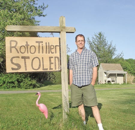 Glen Hathaway, owner of a flower stand on Squamscott Road, is closing operation after 17 years. He decided to close after a rototiller was stolen earlier this month.