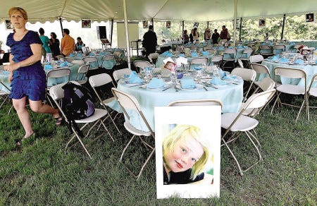 Pictures of students from the Seacoast Charter School adorn the dining area at the 2nd Annual Seacoast Charter Chef Competition at the Applecrest Farm Orchards in Hampton Falls, N.H., Sunday, May 23, 2010. (Portsmouth Herald Photo/Cheryl Senter)
