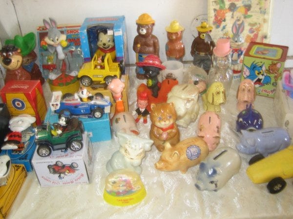 Audrey Stafford set up a display including banks, old toys, and collectible steins.