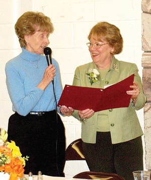 Alexander Dunsmuir Award winner Judy Harvey while being recognized Friday night by former winner and past Botanical Gardens Botanical Gardens president Harriet Alto.