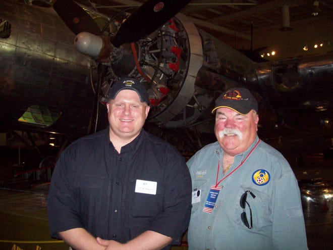 Assistant J.E.B. Harper, left, and Jim Grismer stand in front of the City of Savannah B-17G that is being restored at the Mighty Eighth Air Force Museum in Pooler.