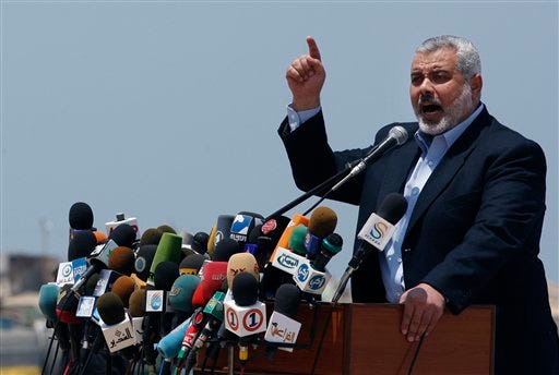 Gaza Hamas Prime Minister Ismail Haniyeh gives a speech ahead of the expected arrival of a flotilla of hundreds of pro-Palestinian activists trying to sail into the Gaza Strip, in Gaza city, Saturday, May 29, 2010. Ships carrying 10,000 tons of aid supplies for blockaded Gaza are being held up near Cyprus as organizers try to get more than two dozen high-profile activists on board. The would-be passengers, including 17 European legislators and a Holocaust survivor, were expected to join the ships from Cyprus. Organizer Greta Berlin said Saturday the Cypriot government is not allowing smaller boats to carry the group to the flotilla waiting in international waters.