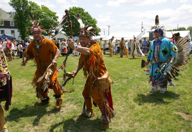 Native dancers perform the Grand Entry dance during Saturday's Spring Planting Moon Pow-Wow and Crafts Festival held Saturday in Marshfield.