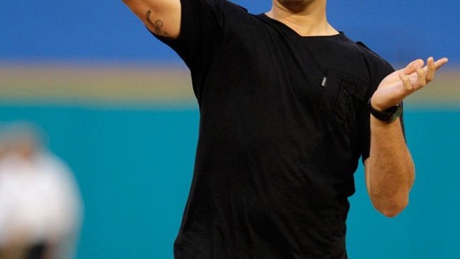 Chad Henne throws out the first pitch before Friday's Phillies-Marlins game at Sun Life Stadium in Miami Gardens.