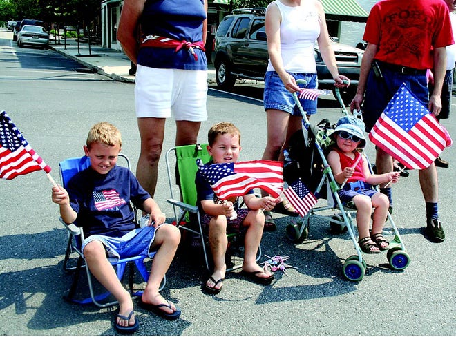 From left, Adam, 6, Mason, 5, and Anna, 2. Booze, of Marion, enjoyed Monday’s Memorial Day parade through Greencastle, and, of course, the flag waving involved.