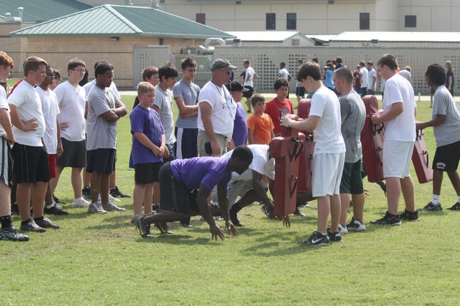 Campers work on drills Wednesday morning during the D'town Football Camp.