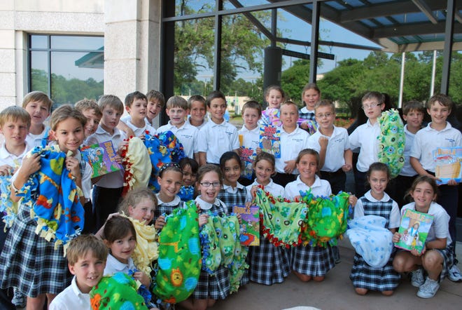 St. Peter third-graders deliver blankets, coloring books and crayons for children at Candler Hospital.