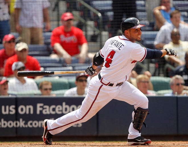 Atlanta Brvaes' Omar Infante drives in the go-ahead run with a base hit in the eighth inning of a baseball game against the Philadelphia Phillies in Atlanta, Wednesday, June 2, 2010. The Braves won 2-1. (AP Photo/John Bazemore)