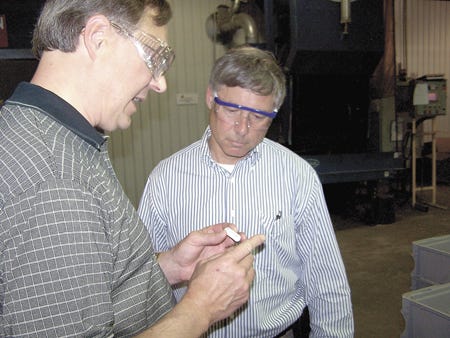 John Hagenbarth, left, controller of Peterson Springer, led U.S.?Rep. Fred Upton on a factory tour Wednesday. Upton spent an hour at the plant in an effort to learn more about the outlook for area manufacturers.