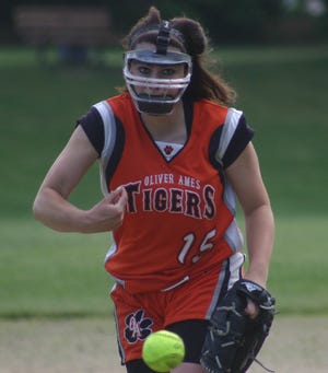 Oliver Ames sophomore pitcher Elizabeth Batsinelas fires a pitch to the plate in her complete game victory over Notre Dame Academy in the Division 1 South Sectional Tournament in Hingham yesterday. The Tigers won the game, 20-5, and will now advance to play either Quincy or Dartmouth in the first round.