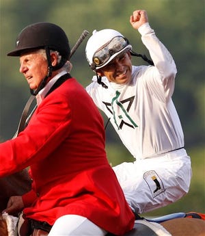 Jockey Mike Smith, right, celebrates after riding Drosselmeyer to win the 142nd running of the Belmont Stakes at Belmont Park in Elmont, N.Y., Saturday, June 5, 2010. (AP Photo/Kathy Willens)