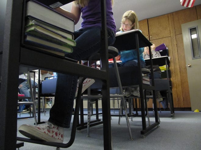 Sixth-graders at Hope Lutheran School in Idaho Falls, Idaho, use 
height-adjustable work stations that can offer notorious fidgeters some 
relief. The Idaho National Laboratory is collaborating with the Mayo Clinic 
on a study of the results.ASSOCIATED PRESS / JESSIE L. BONNER