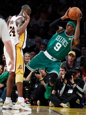 Los Angeles Lakers guard Kobe Bryant is called foul against Boston Celtics guard Rajon Rondo during the second half of Game 2 of the NBA basketball finals on Sunday in Los Angeles.