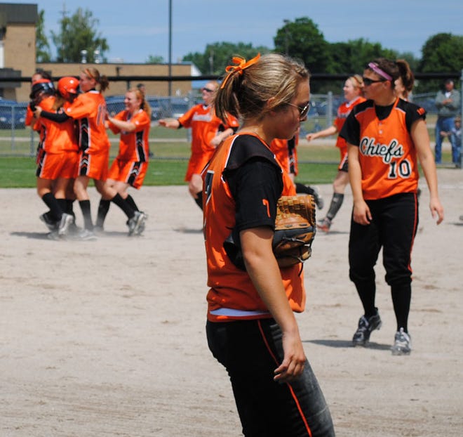 Cheboygan's Morgan Stempky (front) and Megan Charboneau (right) walk off the field as Escanaba celebrates a 1-0 win in Saturday's Division 2 district semifinals.