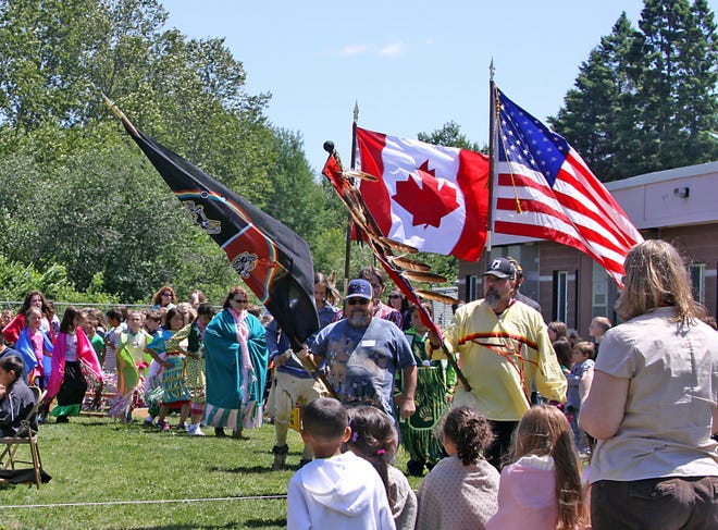 J.K.L. Bahweting held their 11th annual Jiingtamok Pow Wow on Monday afternoon. This photo depicts the Grand Entry and Veteran’s song where flag-bearers, led by Les Ailing, and performers danced around the Bahweting Singers. The Ogimaa-minisinoo (school drum) and Aabizii (Bay Mills) drummers also performed. Activities also included two-step and spot dances and the Closing flag song and retreat. The events were announced by Bucko Teeple.