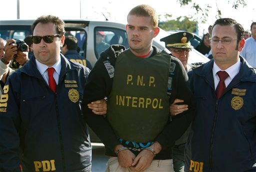 Chile's police officers escort Dutch citizen Joran Van der Sloot, center, to "La Concordia" Peruvian police station, near the border with Chile, in Tacna, Peru, Friday, June 4, 2010. Chilean police have turned over van der Sloot, murder suspect in Sunday's killing of 21-year-old Stephany Flores, to Peruvian authorities at the countries' border. Van der Sloot was previously arrested in the 2005 disappearance of U.S. teen Natalee Holloway, but later released by Dutch authorities.