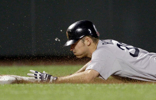 Boston Red Sox' Josh Reddick slides safely into third base for a triple during the eighth inning of a baseball game Saturday against the Baltimore Orioles in Baltimore. The 2005 South Effingham graduate was called up from Triple-A Pawtucket earlier in the day and started in centerfield. (Rob Carr/The Associated Press)