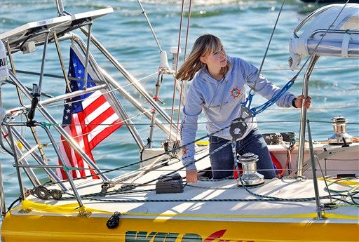 Abby Sunderland, 16, looks out from her sailboat, Wild Eyes, as she leaves for her world record attempting journey on Jan. 23 at the Del Rey Yacht Club in Marina del Rey, Calif. Rescuers searched Thursday for her somewhere between Africa and Australia. He says emergency beacons were activated overnight and there has been a loss of communication. She was feared in trouble in the southern Indian Ocean.