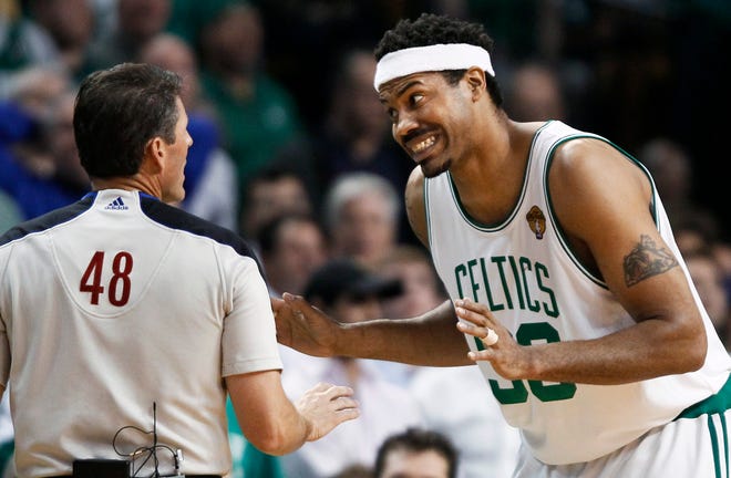 Boston Celtics center Rasheed Wallace, right, appeals to referee Scott Foster during the first quarter in Game 4 of the NBA basketball finals against the Los Angeles Lakers.