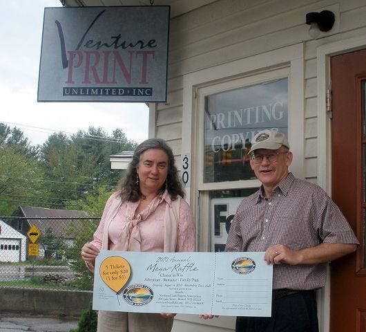 Dawn Lemieux, proprietor of Venture Print Unlimited, Inc. of Bristol and Plymouth, presents Newfound Lake Region Association Director Boyd Smith with a donation of 5,000 tickets for the NLRA’s 2010 Mega-Raffle. Venture Print is an example of a local business that provides high quality, environmentally-friendly services at competitive prices while supporting community nonprofits.