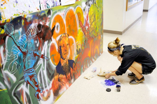 Sophomore Meredith Truelove works on the mural last month.
