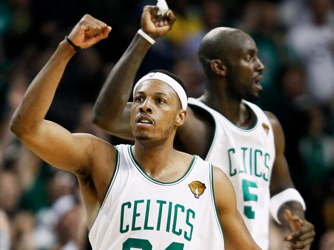 Paul Pierce, front, and Kevin Garnett celebrate the Celtics' Game 5 win against the Lakers on Sunday night in Boston.