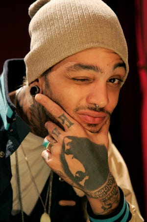 In this May 12, 2010 file photo, recording artist Travie McCoy poses for a portrait in New York.