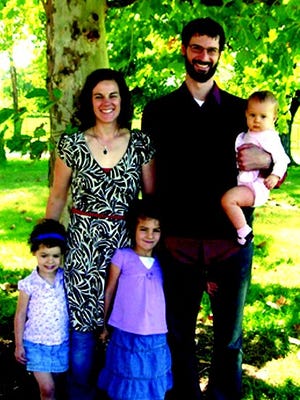 New to congregation: Dan Leman began his duties Sunday as pastor of Metamora's Faith Evangelical Free Church. He is pictured here with his wife, Jen, and children Ange, Kit and Tally.