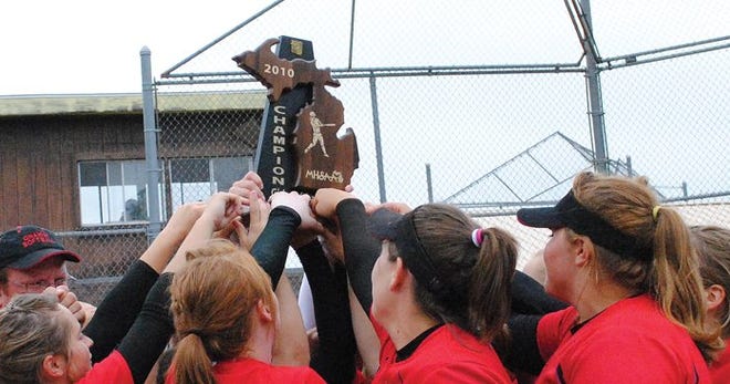 Onaway players and coaches celebrate their Division 4 regional championship on Saturday.