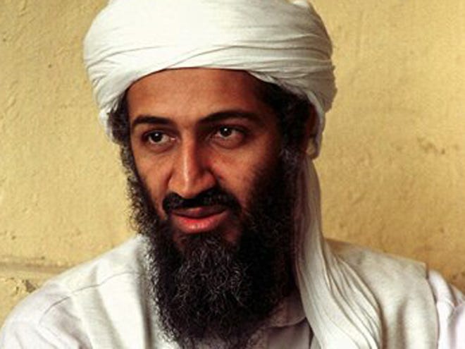 Exiled al-Qaida leader Osama bin Laden looks on in Afghanistan in this April 1998 photo. An American armed with a pistol and a 40-inch sword was detained in northern Pakistan and told investigators he was on a solo mission to kill bin Laden, a police officer said Tuesday.