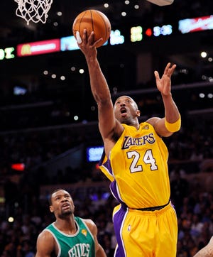 LOS ANGELES' KOBE BRYANT soars for a layup in front of Boston's Tony Allen during the Lakers' victory in Game 6 of the NBA Finals on Tuesday night in Los Angeles. Bryant scored 26 points to lead the Lakers' as they forced a Game 7, which will be played at 9 p.m. Thursday in the Lakers' Staples Center.