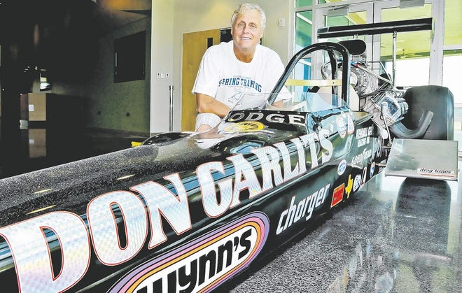 Hank Longo, manager of visitor services for the Polk County Tourism and Sports Marketing, is pictured with a new addition to the Florida Sports Hall of Fame at the Lake Myrtle Sports Complex in Auburndale, "Big Daddy" Don Garlits' top fuel dragster. Tuesday, June 15, 2010