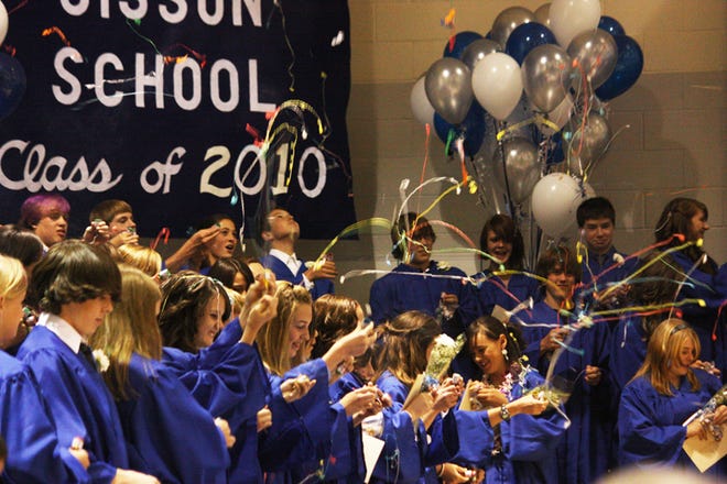 Sisson Elementary School graduates celebrated at the conclusion of their commencement ceremony on Thursday with dozens of bottle rockets sending festive streamers into the air.