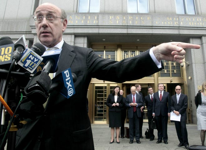 While other attorneys wait their turn at media microphones, Kenneth Feinberg, left, former special master for the September 11th Victim Compensation Fund, speaks during a news conference outside U.S. Federal District Court, Thursday, June 10, 2010, in New York. The judge overseeing a lawsuit by thousands of ground zero workers exposed to World Trade Center dust has cleared the way for a $712.5 million compensation for victims.