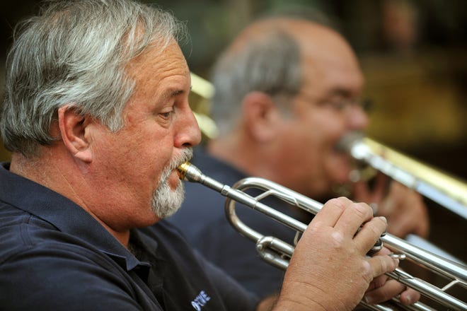 Don Reynolds, retired band director at West Nassau High School, performs with the First Coast Wind Ensemble's brass quintet at the First Wednesday Art Walk on June 2.