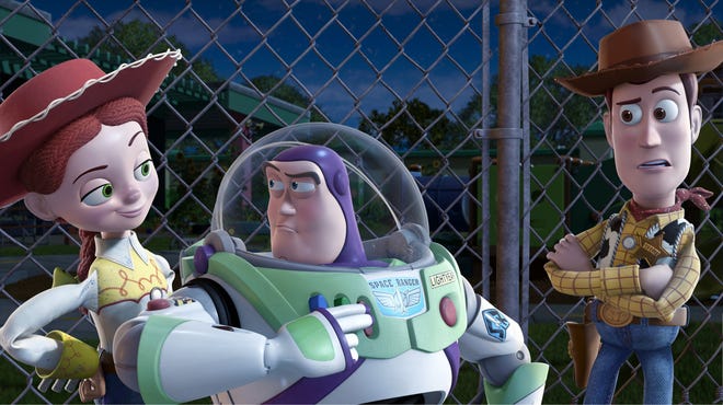 In this film publicity image released by Disney, from left, Jessie, voiced by Joan Cusack, Buzz Lightyear, voiced by Tim Allen and Woody, voiced by Tom Hanks are shown in a scene from, "Toy Story 3."