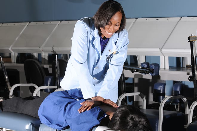 Kiofa Clark, 26, a chiropractic student, is graduating and wants to change the number of minorities in her new 
profession.