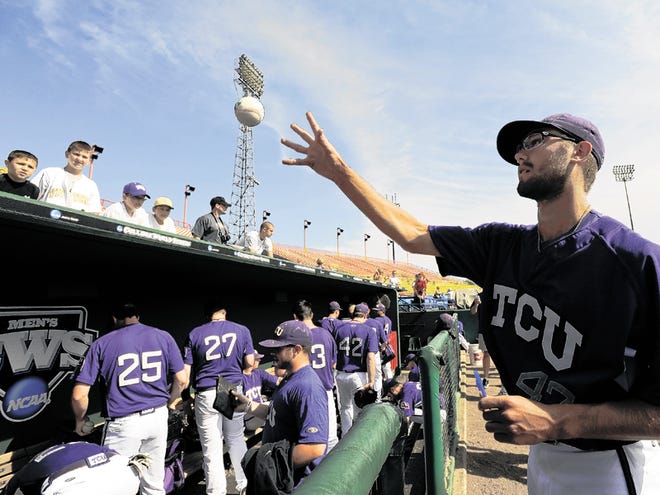 TCU's Matt Purke throws an autographed ball to fans, during basebaLL practice at Rosenblatt Stadium in Omaha, Neb., Friday, June 18, 2010. TCU plays Florida State in the opening game of the College World Series on Saturday.