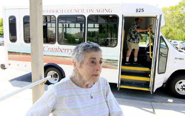 June Cohen of Harwich lauds the Harwich Council on Aging's new 14-passenger van, the Cranberry Coach, as "wonderful."