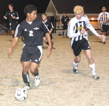 Dutchtown’s Rickey Lawrence, shown controlling the ball against St. Amant, has been named to the LHSSCA Boys Soccer All State Team for the 2009-10 season.