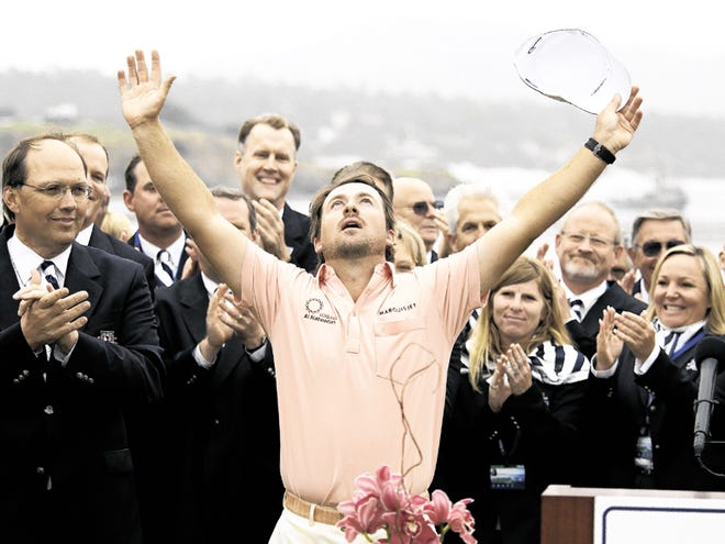 Graeme McDowell of Northern Ireland reacts at the trophy ceremony after winning the U.S. Open golf tournament Sunday, June 20, 2010, at the Pebble Beach Golf Links in Pebble Beach, Calif.