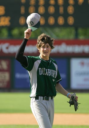Duxbury pitcher Jeff Blout waves to the crowd as he leaves the mound in the seventh inning during the Green Dragons' 3-1 loss to Northbridge on Saturday in the Division 2 state championship game in Lowell.
